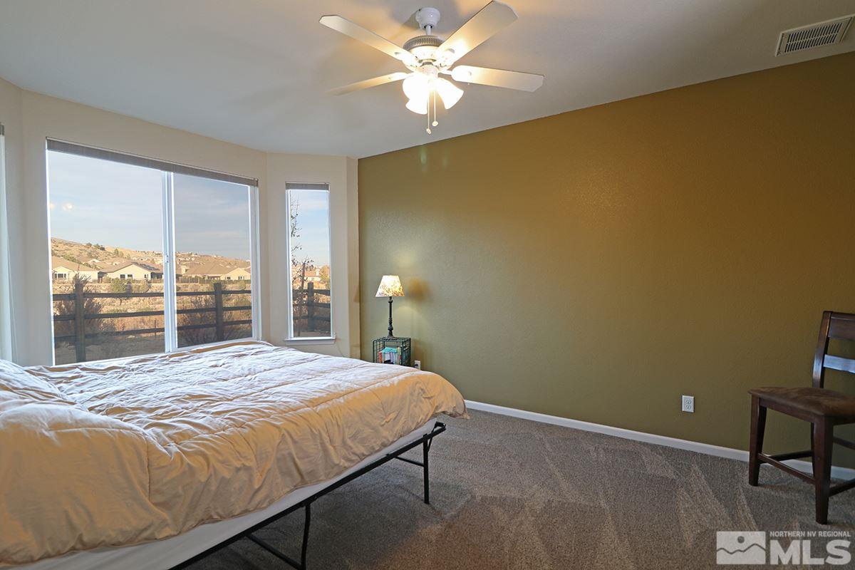 1142 Callaway Trail Reno, NV 89523 - Photo 11 of 21 a bedroom with a bed and a window