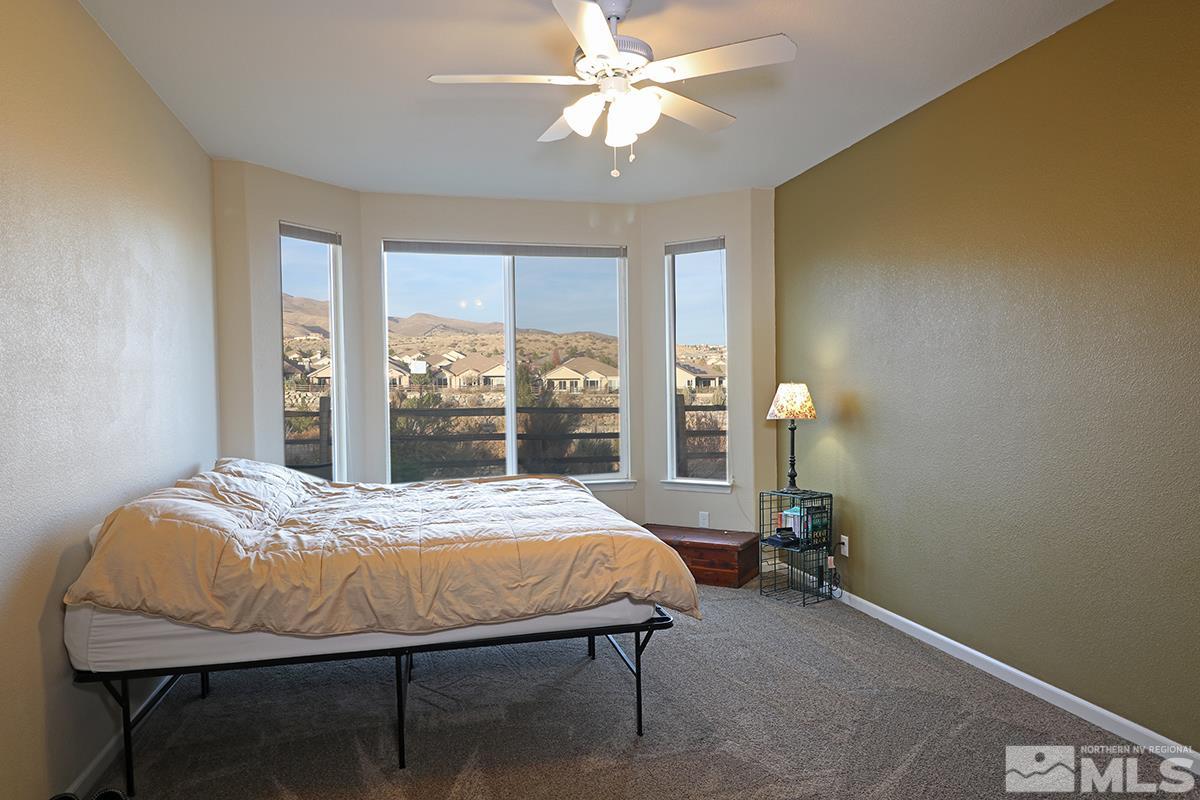 1142 Callaway Trail Reno, NV 89523 - Photo 12 of 21 a bed sitting in a bedroom next to a window