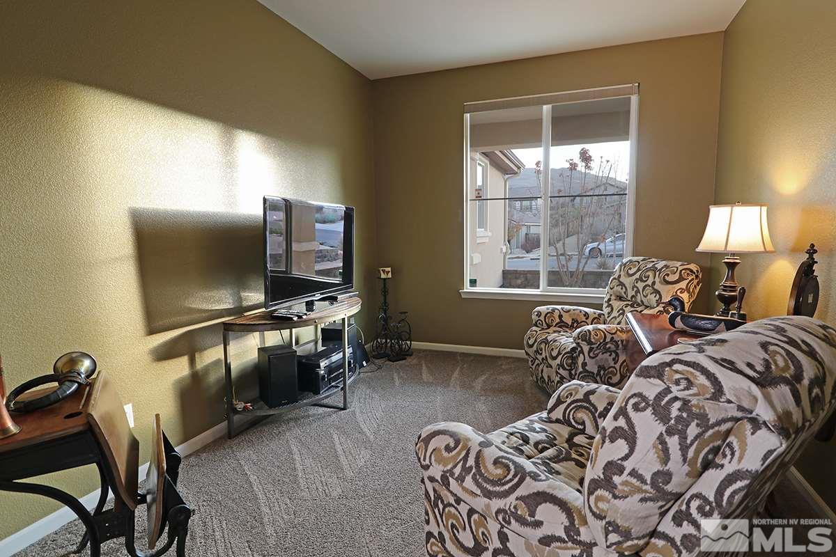 1142 Callaway Trail Reno, NV 89523 - Photo 14 of 21 a living room with furniture a window and flat screen tv