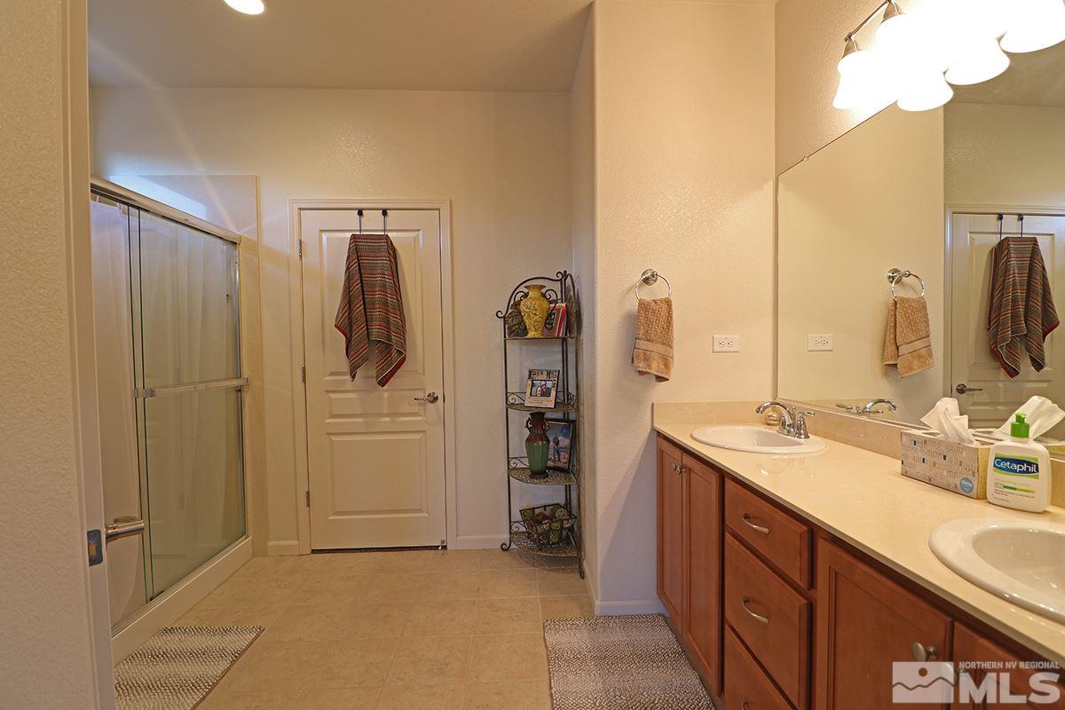 1142 Callaway Trail Reno, NV 89523 - Photo 9 of 21 a bathroom with a double vanity sink and a mirror