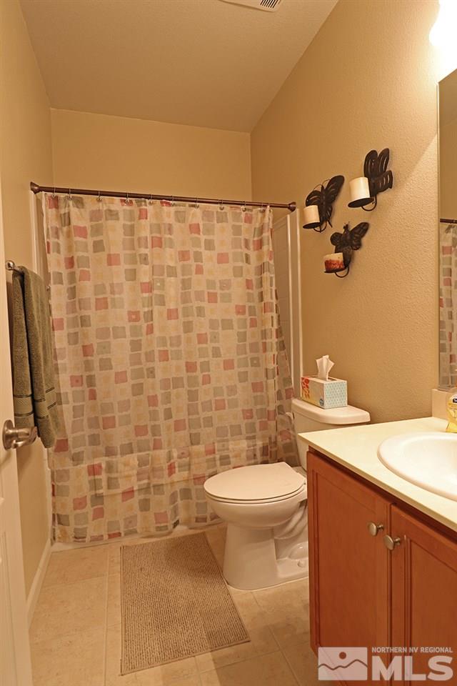 1142 Callaway Trail Reno, NV 89523 - Photo 10 of 21 a bathroom with a sink a toilet and shower