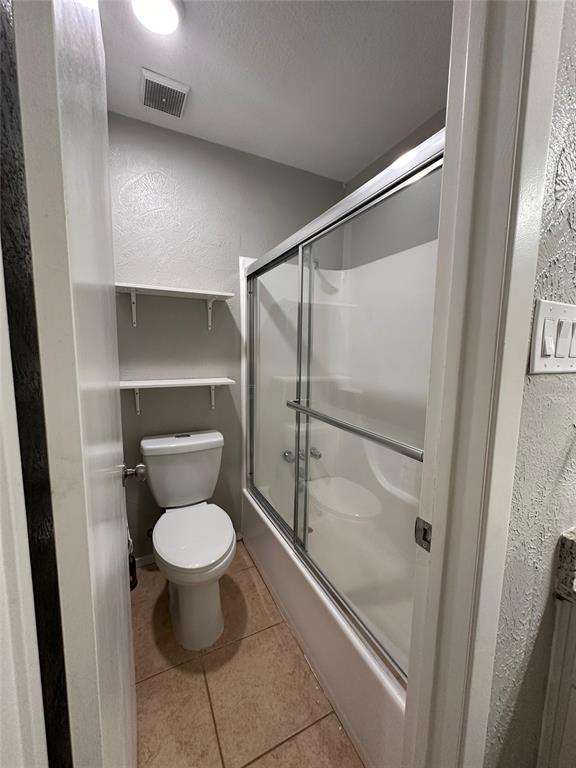 8230 El Retiro Road Fort Worth, TX 76116 - Photo 13 of 21 a bathroom with a toilet and a shower