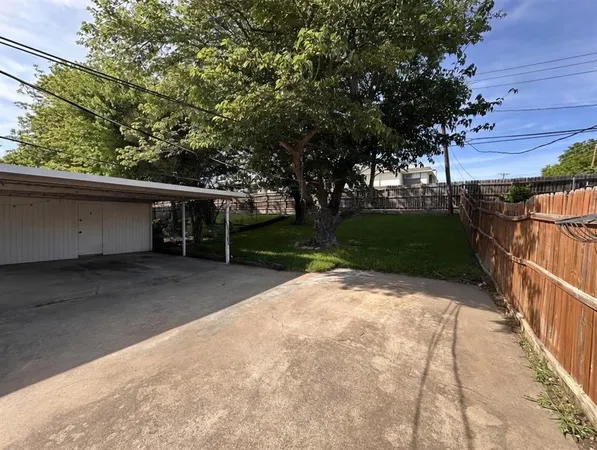a view of backyard with green space