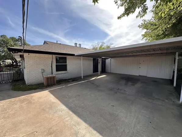 a view of backyard and garage