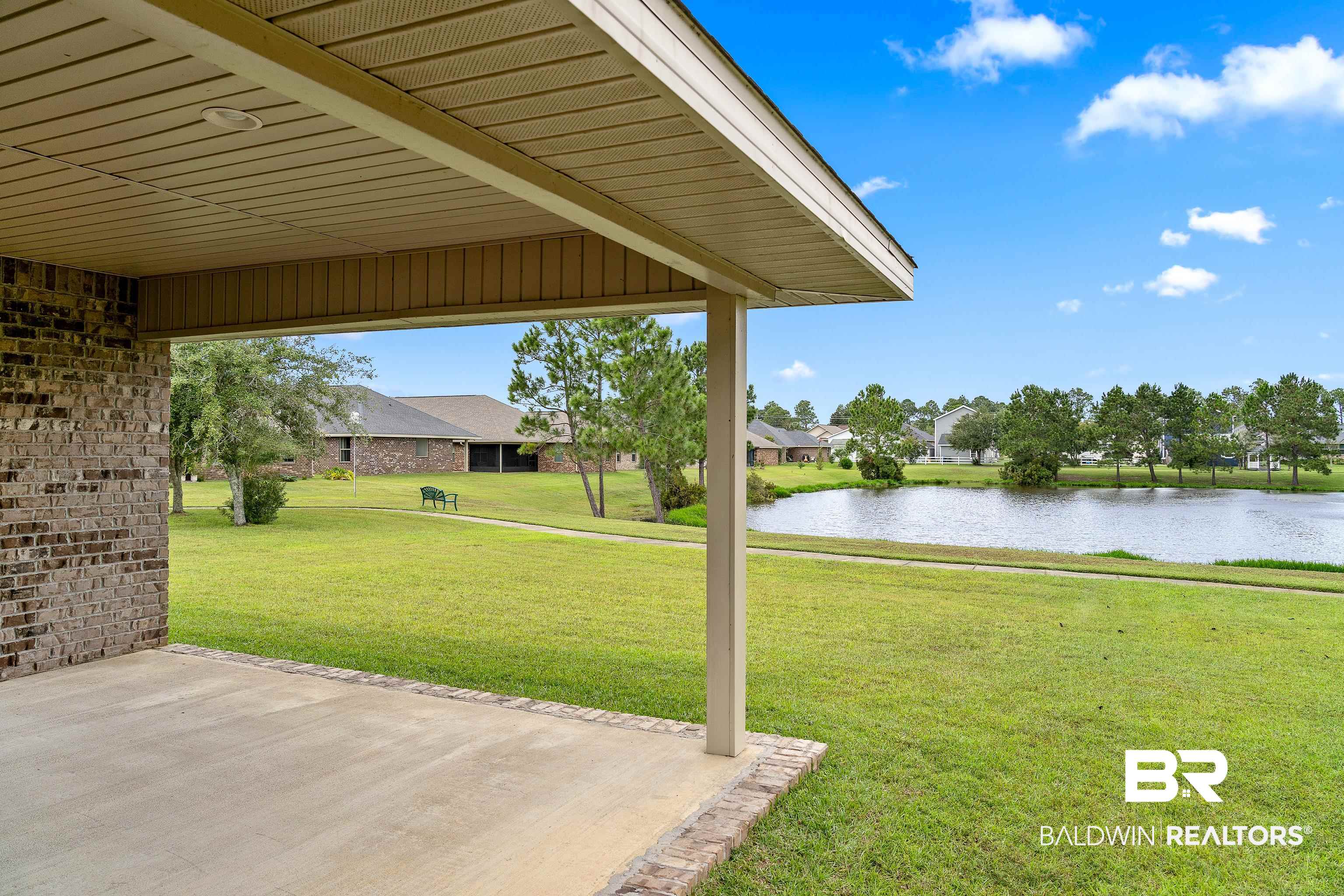 22631 Lake South Drive Foley, AL 36535 - Photo 21 of 25 View of yard with a water view