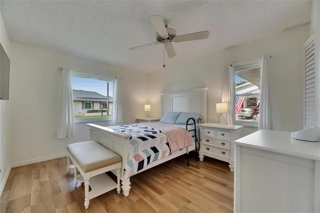 a bedroom with a bed and a table in it