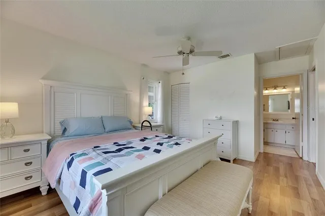 a bedroom with a bed and a walk in closet