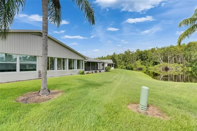 a house with swimming pool in front of it