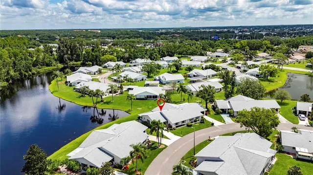 an aerial view of a house with yard swimming pool and outdoor seating