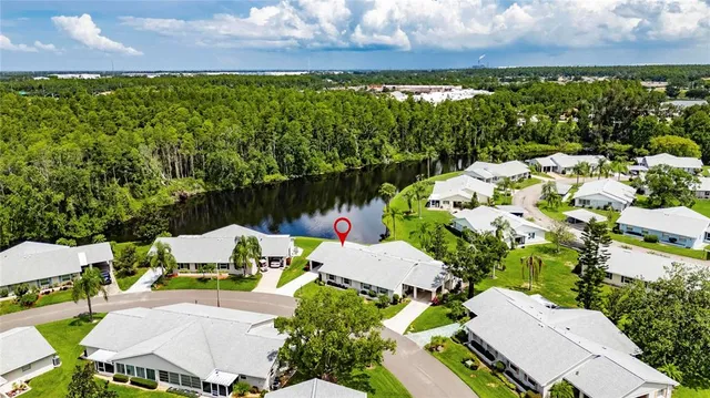 a view of a patio with table and chairs and potted plants