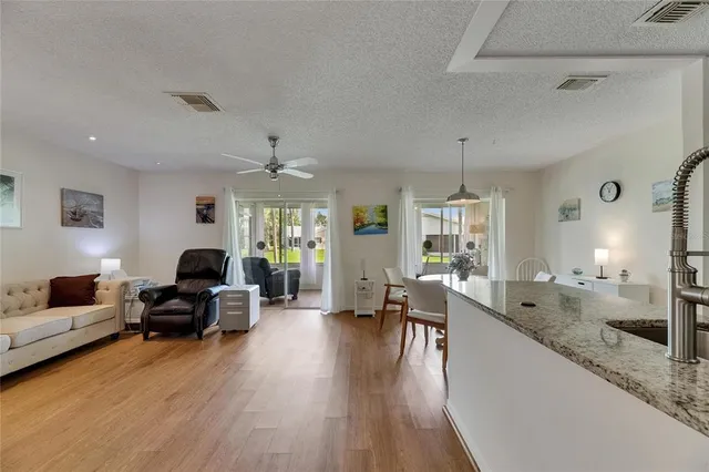 a living room with furniture or couch and a wooden floor