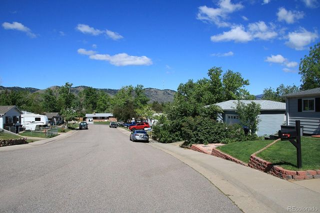 a view of a street with houses