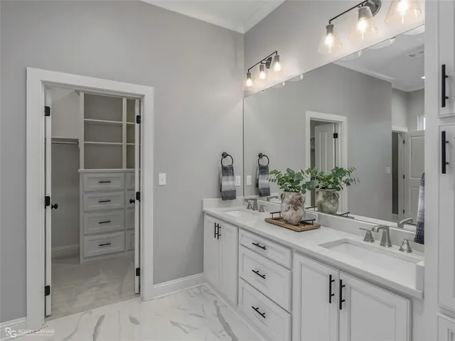 a bathroom with a sink vanity and a mirror