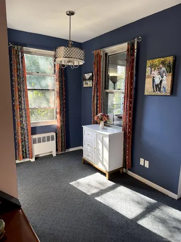 a view of a windows and chandelier in a room