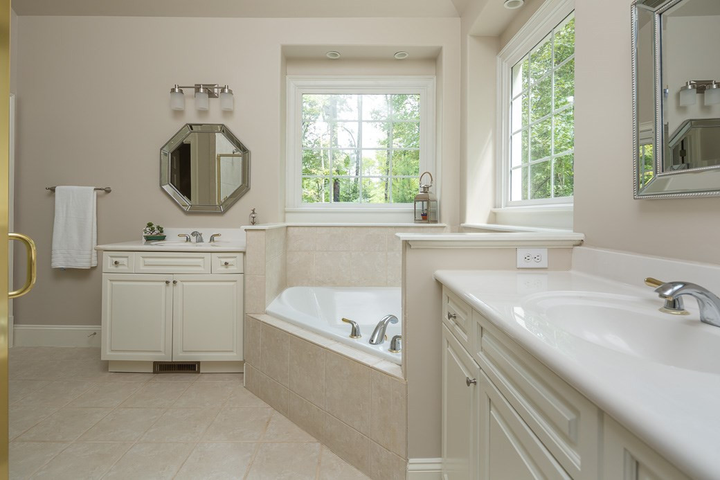 4901 Grilse Way Raleigh, NC 27613 - Photo 11 of 19 Gorgeous master bath with NEW PAINT, HIS & HERS vanities, NEW mirrors and NEW light fixtures. MASTER BATHROOM