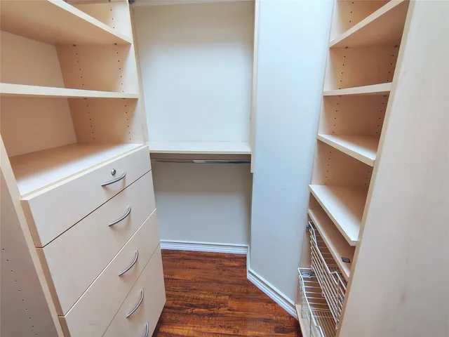 a view of an empty walk in closet