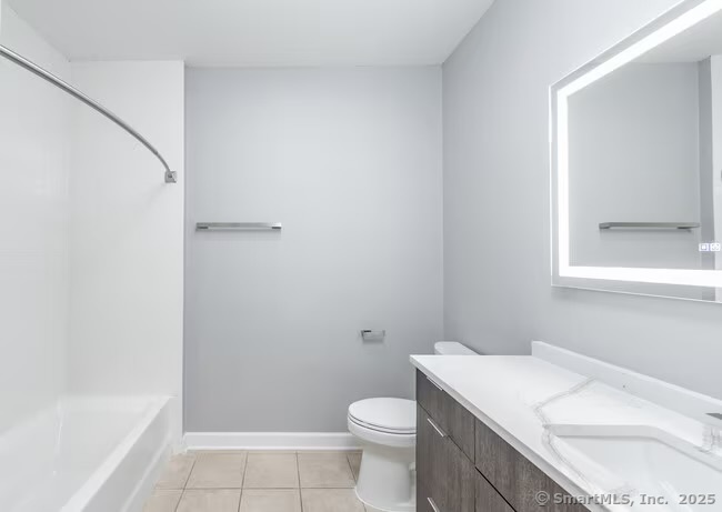 333 State Street, Unit 510 Bridgeport, CT 06604 - Photo 19 of 28 a bathroom with a granite countertop sink toilet and shower