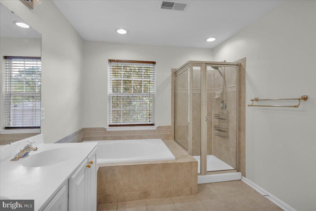 27 Golf View Court Pine Hill, NJ 08021 - Photo 13 of 33 a bathroom with a tub sink and shower