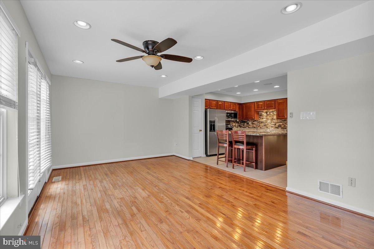 27 Golf View Court Pine Hill, NJ 08021 - Photo 6 of 33 a view of a room with wooden floor and a ceiling fan