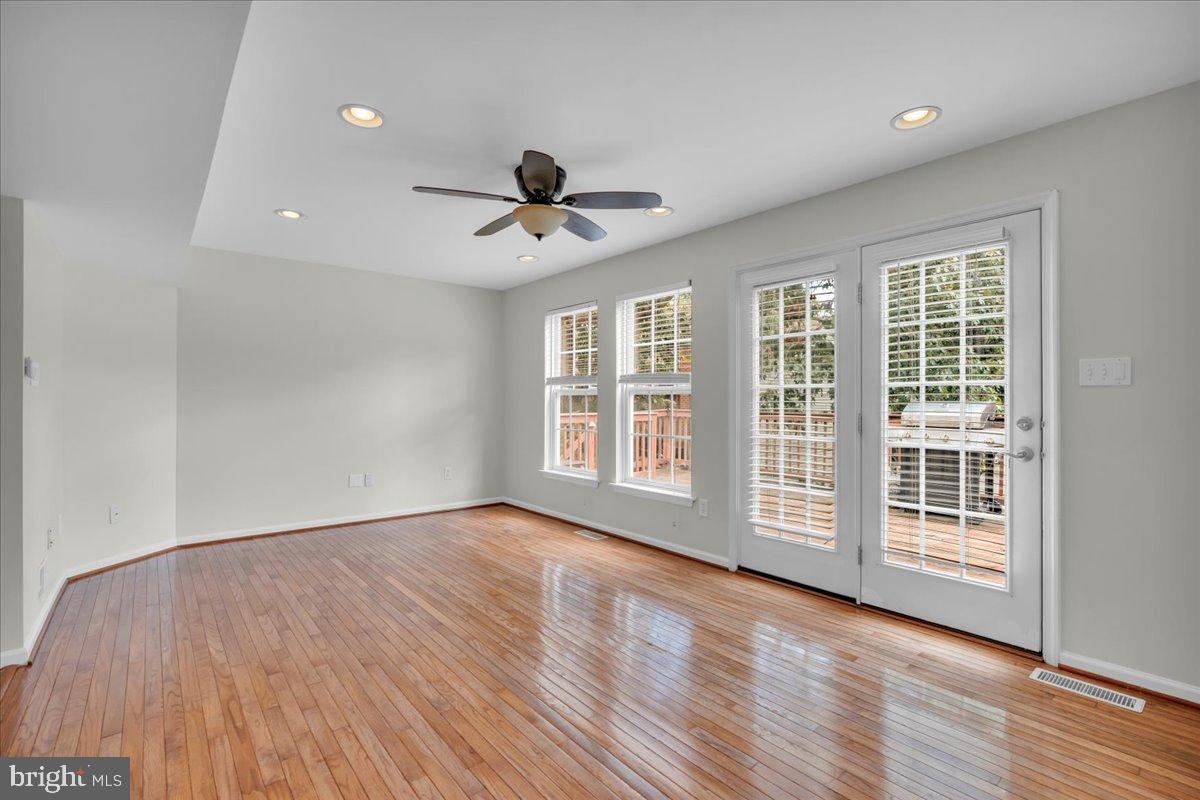 27 Golf View Court Pine Hill, NJ 08021 - Photo 7 of 33 a view of empty room with wooden floor and fan