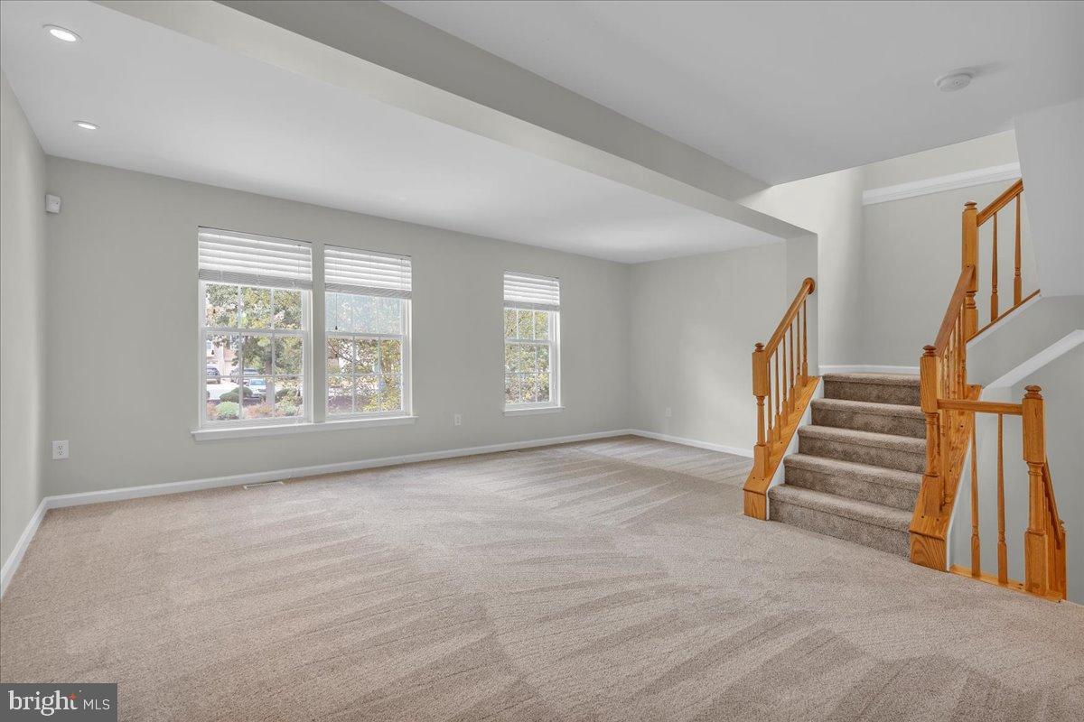 27 Golf View Court Pine Hill, NJ 08021 - Photo 9 of 33 a view of an empty room with stairs and a window
