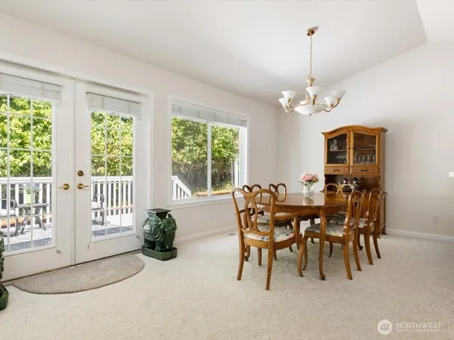 a view of a dining room with furniture window and outside view