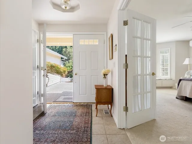 a view of a bathroom with a tub and shower