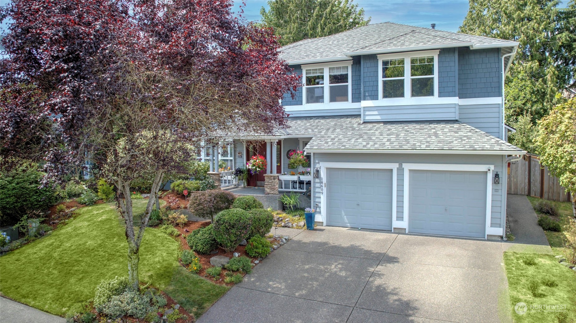 a view of a house with a yard and plants
