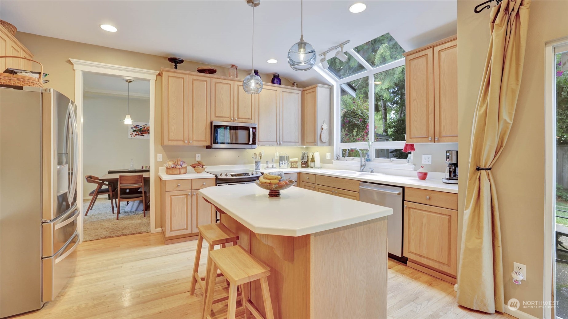 18609 173rd Way Southeast Renton, WA 98058 - Photo 13 of 37 a kitchen with a sink stove and cabinets