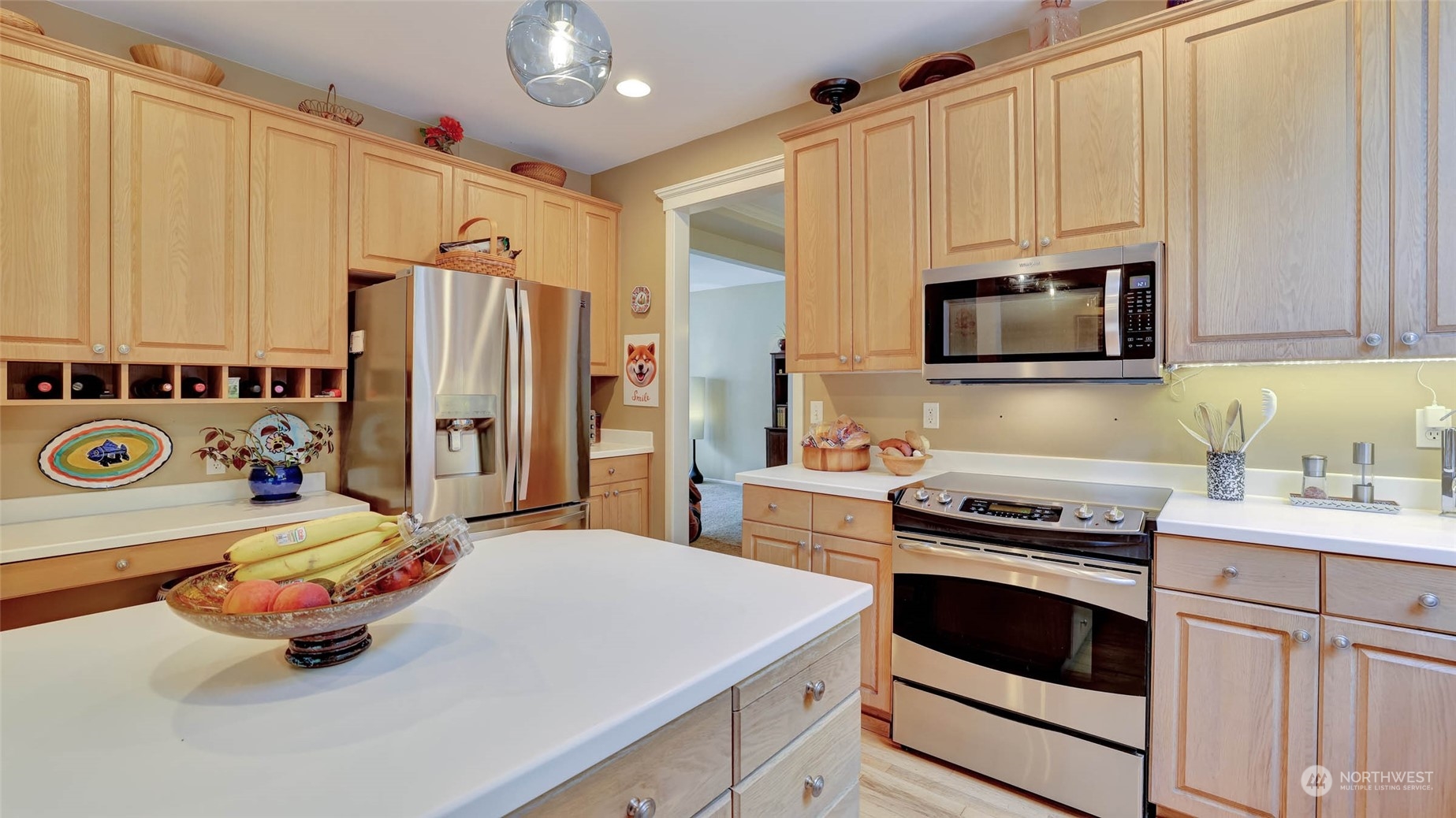 18609 173rd Way Southeast Renton, WA 98058 - Photo 15 of 37 a kitchen with stainless steel appliances a stove a sink and a refrigerator