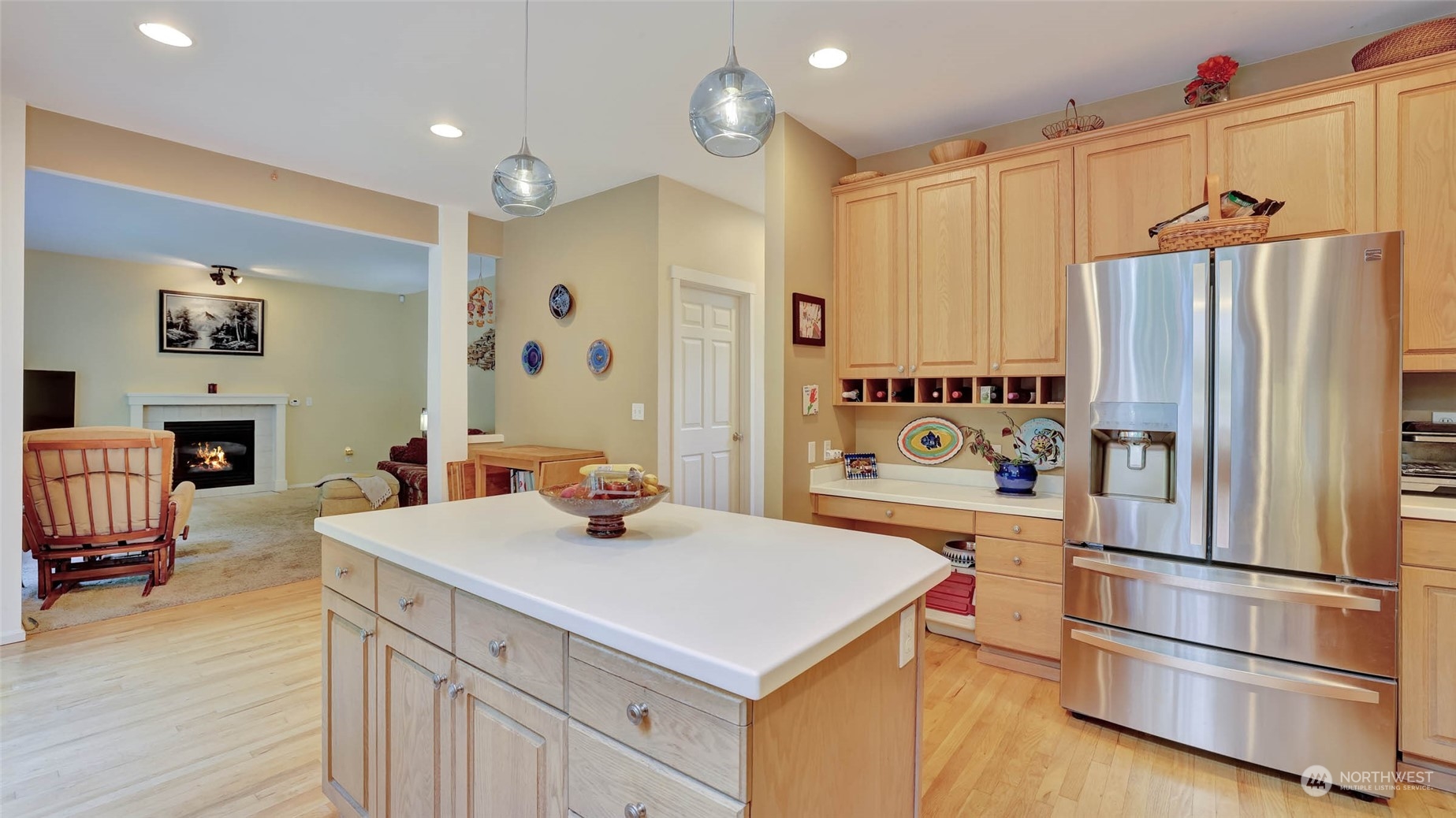 18609 173rd Way Southeast Renton, WA 98058 - Photo 16 of 37 a kitchen with refrigerator cabinets and wooden floor