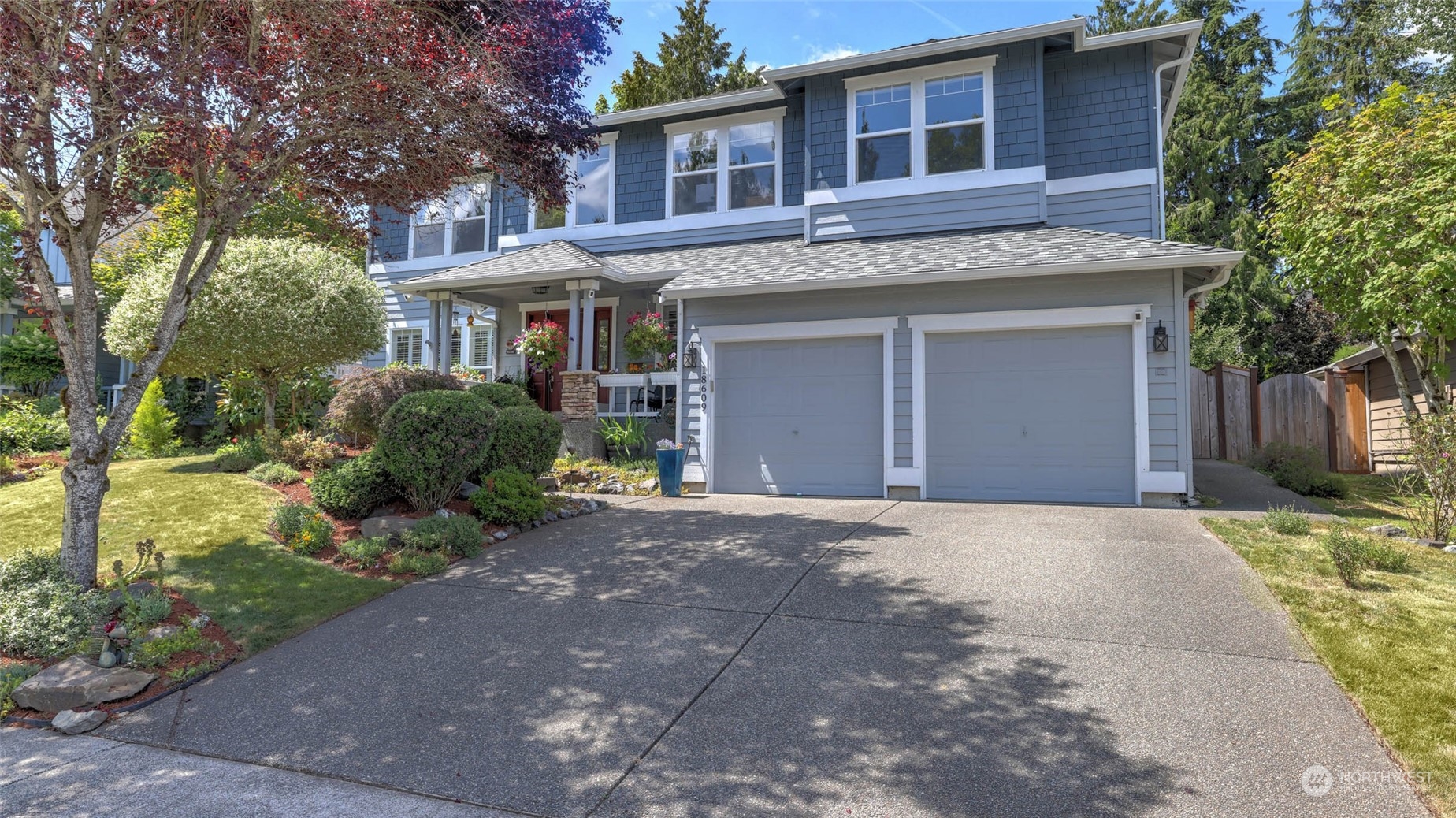 18609 173rd Way Southeast Renton, WA 98058 - Photo 2 of 37 a front view of a house with a yard and garage