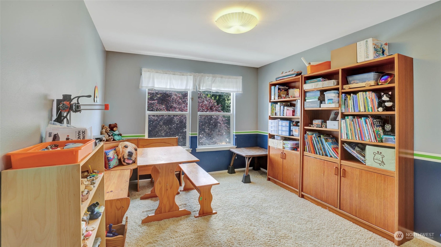 18609 173rd Way Southeast Renton, WA 98058 - Photo 24 of 37 a bed room with a bed and a book shelf