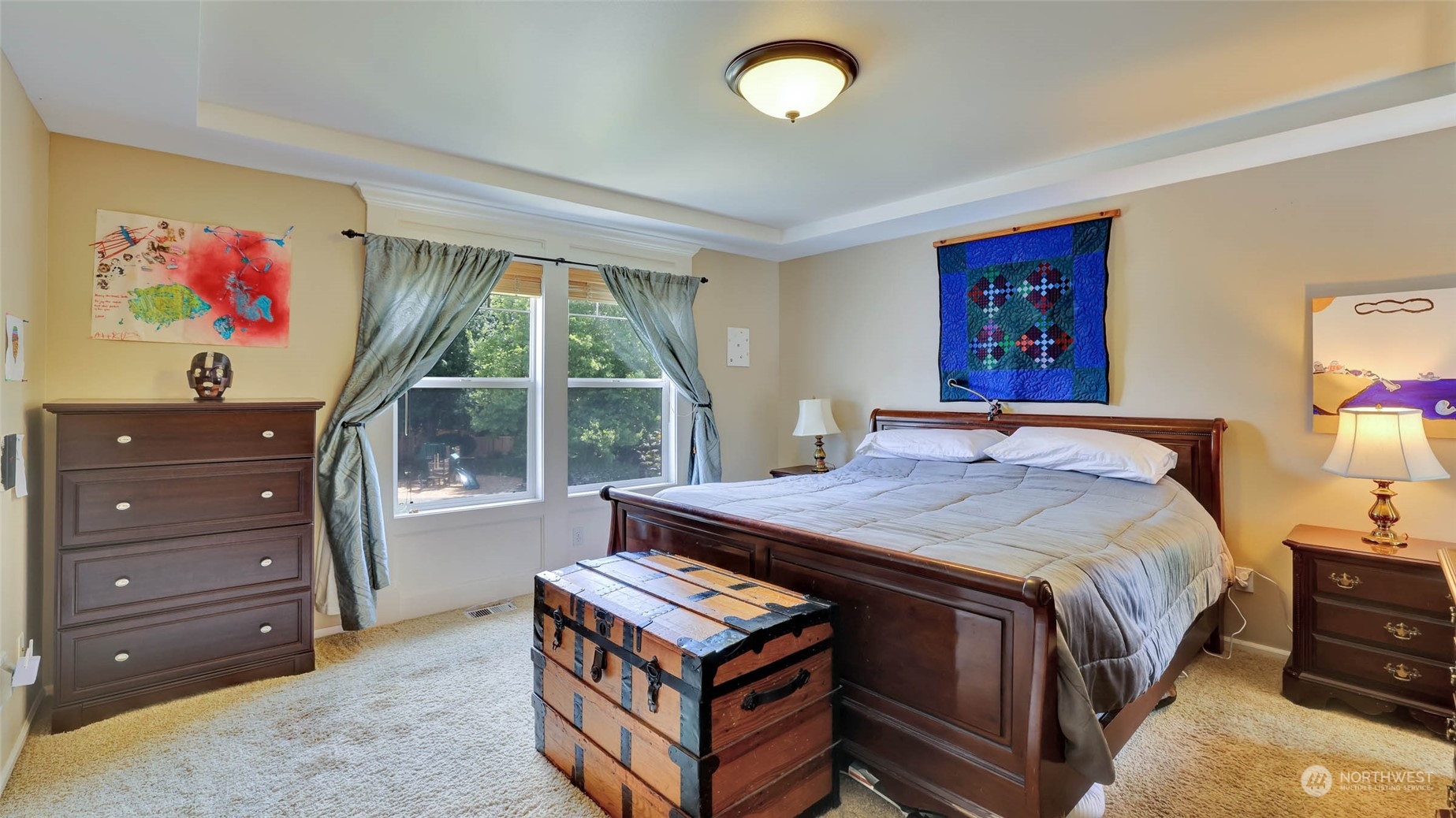 18609 173rd Way Southeast Renton, WA 98058 - Photo 25 of 37 a bed sitting in a bedroom next to a window