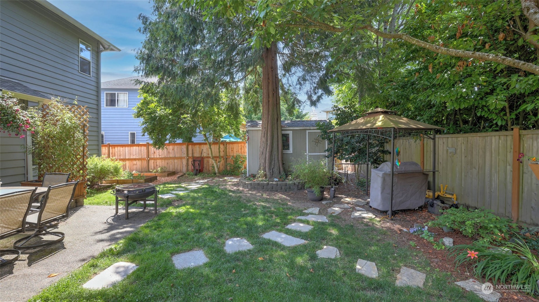 18609 173rd Way Southeast Renton, WA 98058 - Photo 33 of 37 a view of a chair and table in backyard of the house