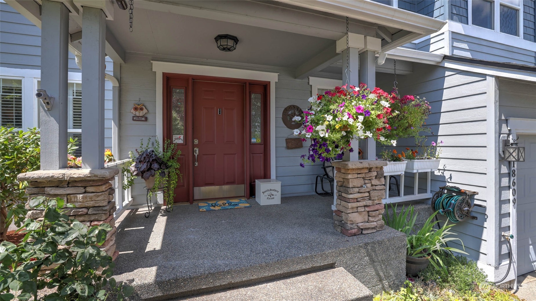 18609 173rd Way Southeast Renton, WA 98058 - Photo 4 of 37 a potted plant sitting in front of a house