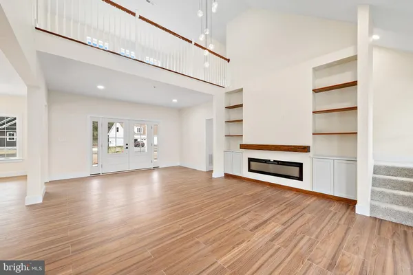 a kitchen with stainless steel appliances granite countertop white cabinets and a sink