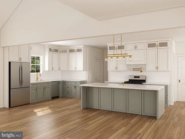 a kitchen with stainless steel appliances a sink cabinets and wooden floor