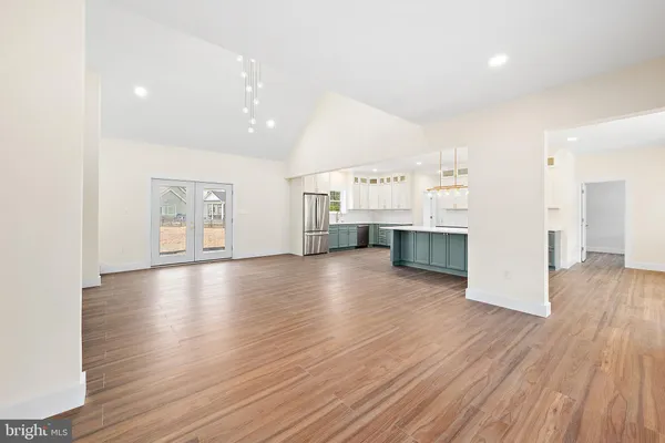 a kitchen with stainless steel appliances a sink and a stove