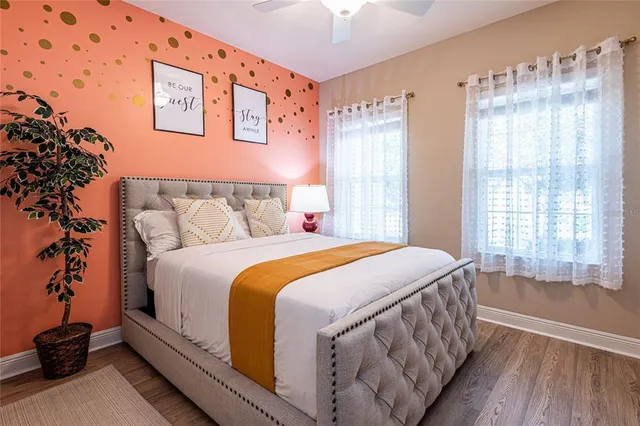 a bedroom with a bed and a window