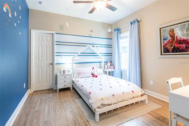 a bedroom that has a bed and a window