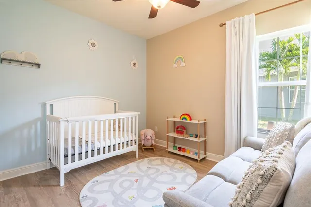 a bedroom with furniture and a window
