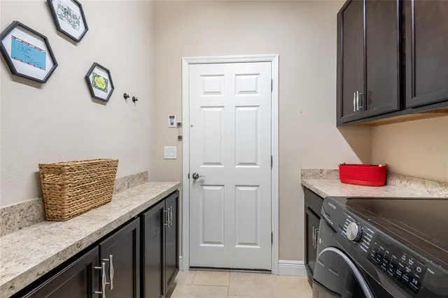 a kitchen with a granite countertop cabinets and a stove