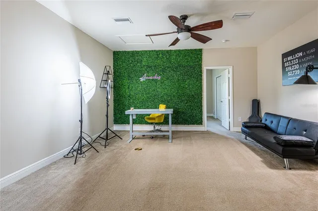 a work room with furniture and a large window