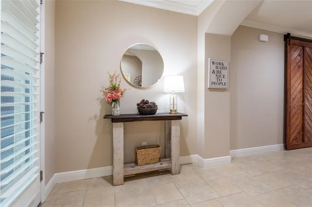 a view of a livingroom with furniture and mirror