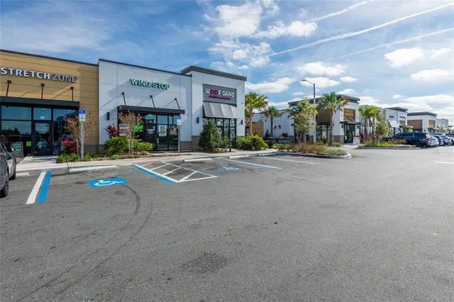 an aerial view of a swimming pool with a patio