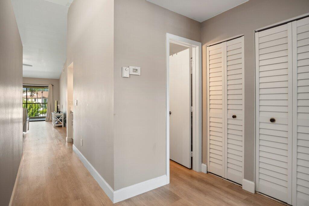 1402 Pinecrest Circle, Unit B Jupiter, FL 33458 - Photo 17 of 56 wooden floor in a gallery