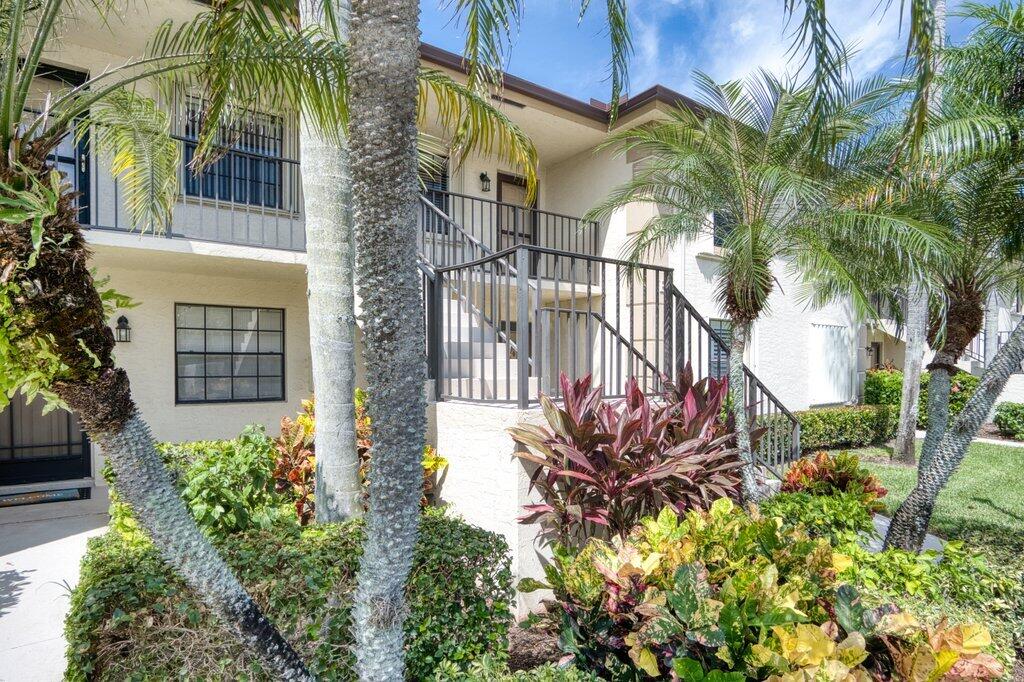 1402 Pinecrest Circle, Unit B Jupiter, FL 33458 - Photo 2 of 56 front view of a house