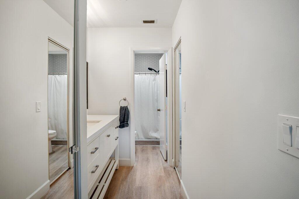 1402 Pinecrest Circle, Unit B Jupiter, FL 33458 - Photo 25 of 56 a view of a bathroom from a hallway