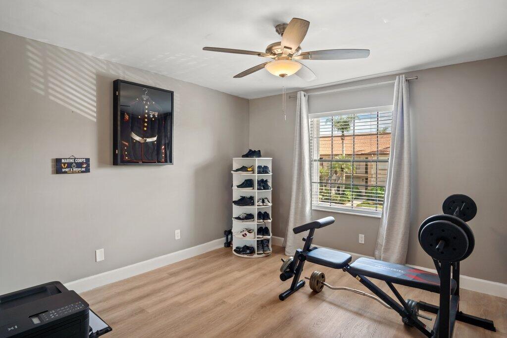 1402 Pinecrest Circle, Unit B Jupiter, FL 33458 - Photo 28 of 56 a view of a workspace with furniture and a window